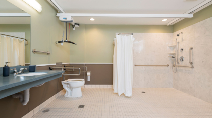 A large accessible shower and bath area with lift in a supported living home for Sunshine Inc. of Northwest Ohio