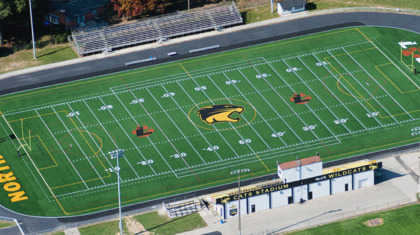 An aerial view of a football field construction project by Miller Diversified