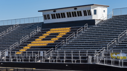 A closup of pressbox and priority bleacher seating from a school commercial construction project by Miller Diversified