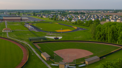Long distance aerial view of the track and field from the Perrysburg High School Track Commercial Construction Project