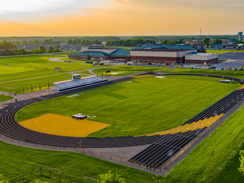 A sunset aerial view of the Perrysburg High School Track Commercial Construction Project