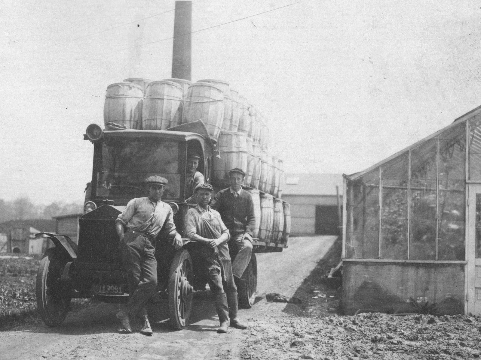 Four of the Miller Brothers are shown at Miller Farm & Greenhouse in Northwest Ohio sometime after the greenhouse was founded in 1920.